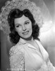 Joan Merrill Leaning to the Right, wearing a White Blouse in a Portrait Photo Print - Item # VARCEL702101