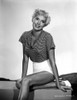 Beverly Michaels on a Printed Top sitting and smiling Portrait Photo Print - Item # VARCEL702107