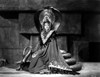Maria Montez sitting on Snake Statue, wearing Long Classic Gown Photo Print - Item # VARCEL702192