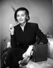 Patricia Neal Seated in Formal Attire with Hat Photo Print - Item # VARCEL702542