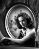Joan Newton sitting on a Bar, Looking at the Camera in Portrait Photo Print - Item # VARCEL702608