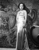 Merle Oberon on a Silk Dress standing Photo Print - Item # VARCEL702818