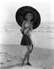 A Portrait Of Anita Page Carrying A Parasol at the Beach Photo Print - Item # VARCEL702863