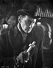 Film still of Peter Cushing holding a cross outdoors Photo Print - Item # VARCEL688935