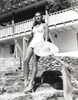 Jinx Falkenburg sitting on a Staircase Photo Print - Item # VARCEL688976