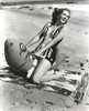 Jinx Falkenburg sitting on a Life Bouy Photo Print - Item # VARCEL688985