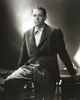 Henry Fonda Black Suit and sitting on a Table Photo Print - Item # VARCEL689300