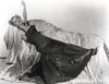 Joan Fontaine Lying on a Couch wearing Black Gown Photo Print - Item # VARCEL689333