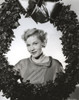 Joan Fontaine wearing a Pearl Necklace and Holding a Christmas Wreath Photo Print - Item # VARCEL689371