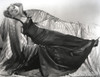 Joan Fontaine Lying on a Couch wearing a Black Gown Photo Print - Item # VARCEL689381