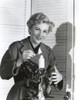 Joan Fontaine Lighting a Candle Photo Print - Item # VARCEL689385