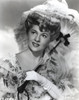 Joan Fontaine wearing a Well Detailed Dress and an Umbrella in a Portrait Photo Print - Item # VARCEL689404