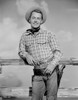 Alan Ladd Leaning on a Wooden Fence in Cow Boy Outfit Photo Print - Item # VARCEL689779
