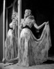 Veronica Lake standing next to a mirror Photo Print - Item # VARCEL689844