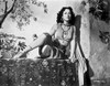 Hedy Lamarr wearing a costume sitting outdoors Photo Print - Item # VARCEL689865