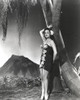 Dorothy Lamour wearing Hawaiian clothing next to a volcano Photo Print - Item # VARCEL689901
