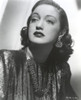 Dorothy Lamour wearing a metallic dress and earrings Photo Print - Item # VARCEL689917
