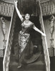 Dorothy Lamour descending stairs wearing a headdress Photo Print - Item # VARCEL689932