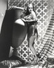 Dorothy Lamour in chains posing with an urn Photo Print - Item # VARCEL689944