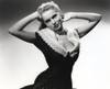 Janet Leigh Posed in Black Velvet Sleeveless Dress and Pearl Necklace with Hand Behind the Head Photo Print - Item # VARCEL690200