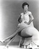 Janet Leigh sitting on a sofa arm Photo Print - Item # VARCEL690203