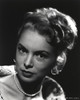 Janet Leigh Posed in White Silk V-Neck Shoulder Dress with Pearl Necklace and Earrings Photo Print - Item # VARCEL690218