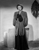Myrna Loy standing in Robe with Gloves Photo Print - Item # VARCEL690527