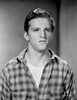 A Stanley Clements wearing a plaid shirt Photo Print - Item # VARCEL691127