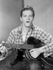 A Stanley Clements playing a guitar Photo Print - Item # VARCEL691129
