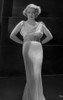 Bette Davis Posed with Hands on the Back in White Broad Strap Dress Photo Print - Item # VARCEL692799