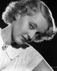 Bette Davis Portrait in White Dress and White Ribbon Tie with Brooch Photo Print - Item # VARCEL692826