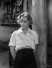 Bette Davis Posed Hands on the Back in Whir Collar Shirt with Sleeves Rolled Up and High Waist Long Skirt Photo Print - Item # VARCEL692982