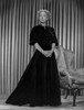 Bette Davis Posed Hands Together and Fingers Crossed in Black Long Sleeve High Neck Dress Photo Print - Item # VARCEL693043