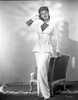 Eve Arden standing in Long Sleeve Blouse Photo Print - Item # VARCEL693130