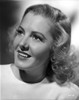 Jean Arthur Portrait in White Silk Round Neck Dress with Eyes Looking Up Photo Print - Item # VARCEL693145