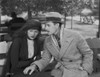 Greta Garbo with a Man wearing Formal Outfit with Hat Photo Print - Item # VARCEL693211