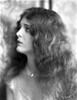 Mary Astro on a Necklace and Curly Long Hair Portrait Photo Print - Item # VARCEL693236