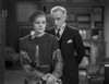 Greta Garbo Listening to a Man in Formal Outfit Photo Print - Item # VARCEL693250