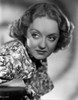 Bette Davis Portrait in Looking at the Right in Floral Silk Shirt with Curly Waved Hairstyle Photo Print - Item # VARCEL693270