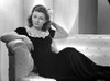 Lenore Aubert on a Dress sitting on a Couch Photo Print - Item # VARCEL693287