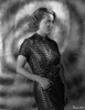 Bette Davis Posed Side View Hand on the Waist in White Polka Dot Black Short Sleeve Dress Photo Print - Item # VARCEL693291
