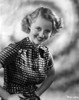 Bette Davis Portrait Hands on the Waist in White Polka Dot Black Short Sleeve Dress Photo Print - Item # VARCEL693296