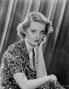 Bette Davis Portrait Hand on the Cheek in Floral Pattern Dress and Short Curls Photo Print - Item # VARCEL693444