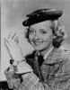 Bette Davis Portrait smiling in Black Flat Hat in Checkered Suit and White Collar Shirt with Tie Photo Print - Item # VARCEL693448