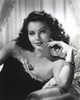 Ava Gardner posed on Couch in Black Dress with Necklace Photo Print - Item # VARCEL693532