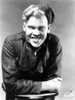 Jack Pennick Leaning on a Table in Jacket and Hat Photo Print - Item # VARCEL693545