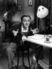William Powell Sitting on Chair, Wearing Black Coat Photo Print - Item # VARCEL693576