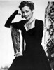 Lynn Bari on a Long Dress and sitting on Chair Photo Print - Item # VARCEL693629