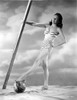 Lynn Bari on a Stripe Swimsuit on a Beach Photo Print - Item # VARCEL693635