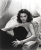 Ava Gardner Lying on a Couch wearing a Black Gown Photo Print - Item # VARCEL693682
